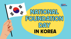 A hand holding a Korean flag